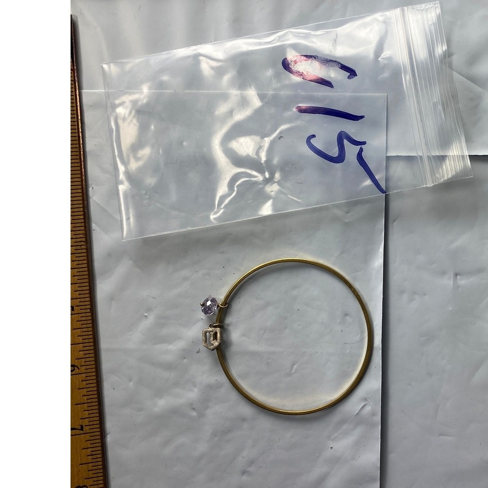 Gold Tone Bangle Bracelet with Clear and Purple Gemstones